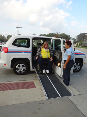 SARTA driver assisting a Proline rider off the bus.