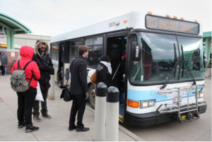 A group of riders boarding a SARTA bus on the 103 Route.