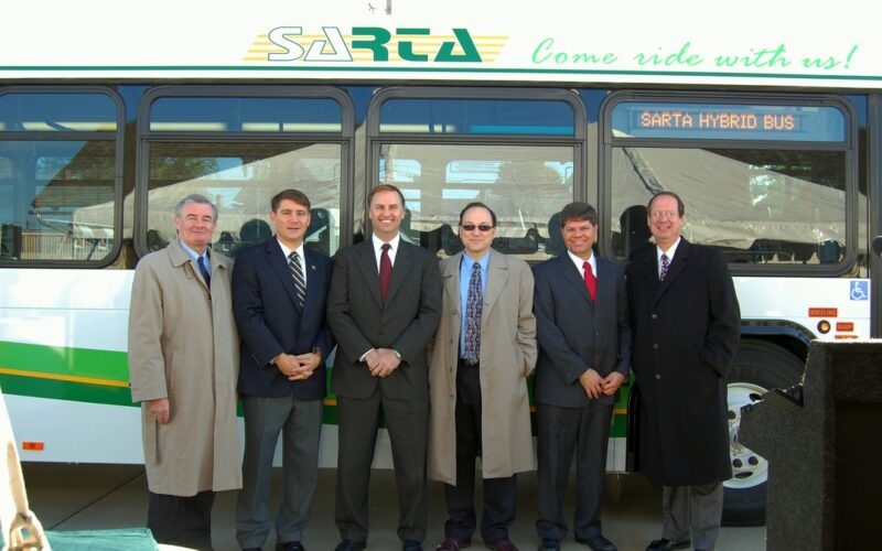 SARTA CEO and City Leaders standing in front of the SARTA Hybrid Bus