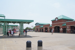 Image of passengers/riders standing at the islands at Cornerstone Transit Center.