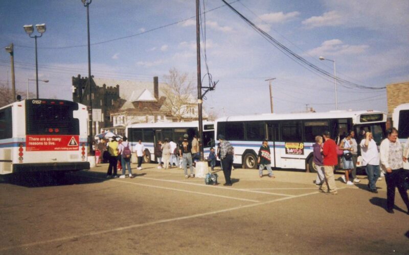 Riders catching the buses at the temporary zone at 700 Block of Market Ave. South