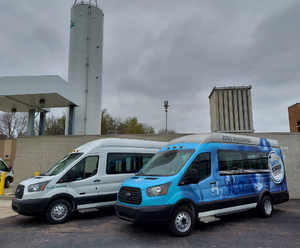 A picture of 2 hydrogen fuel cell vans outside on the SARTA Headquarters by the Hydrogen Fueling Station.