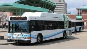 An image of a CNG SARTA bus at the Cornerstone Transit Center. With another SARTA bus parked right behind it.