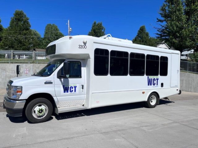 A side profile of a SARTA/Wayne County Transit Bus.