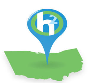 Hydrogen Hub Alliance Logo- pictured is a green silhouette of Ohio with a blue location pin above it, featuring the white letters 'h2' encircled by a green ring
