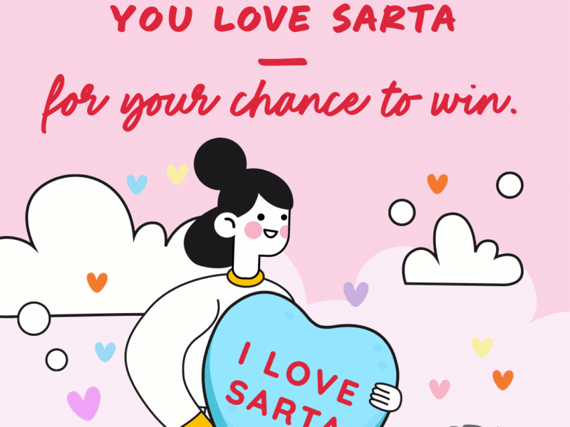 Put a Litte SARTA in your Heart Graphic A Valentine's Day-themed animated GIF with a pink background, heart accents, and playful cartoon-style artwork. It features a smiling character holding a large blue candy heart with the text 