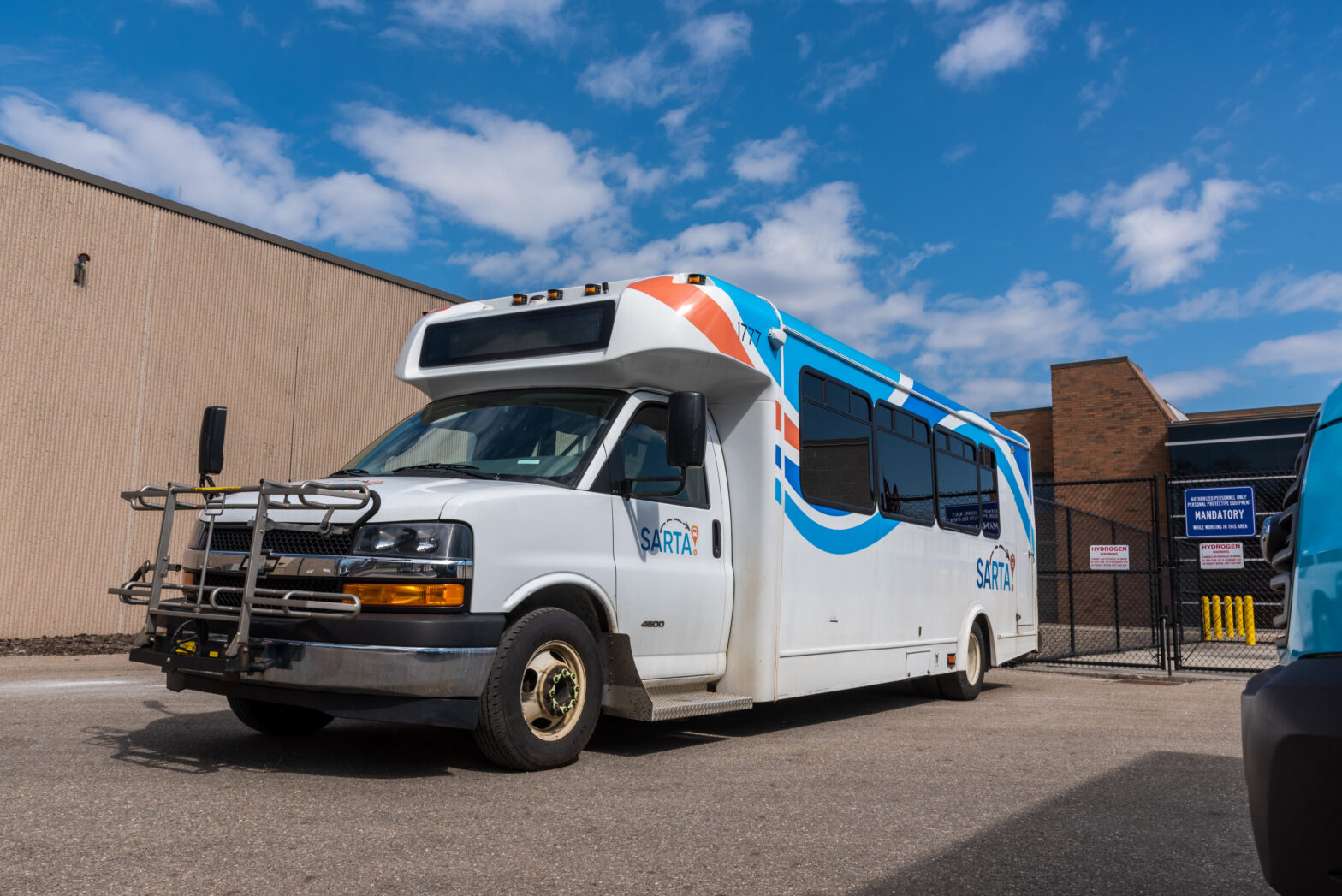 This is an image of a SARTA paratransit bus parked outside of SARTA's bus garage.