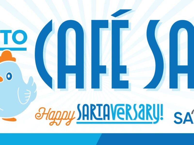 A banner with a bright blue and orange design welcomes visitors to 